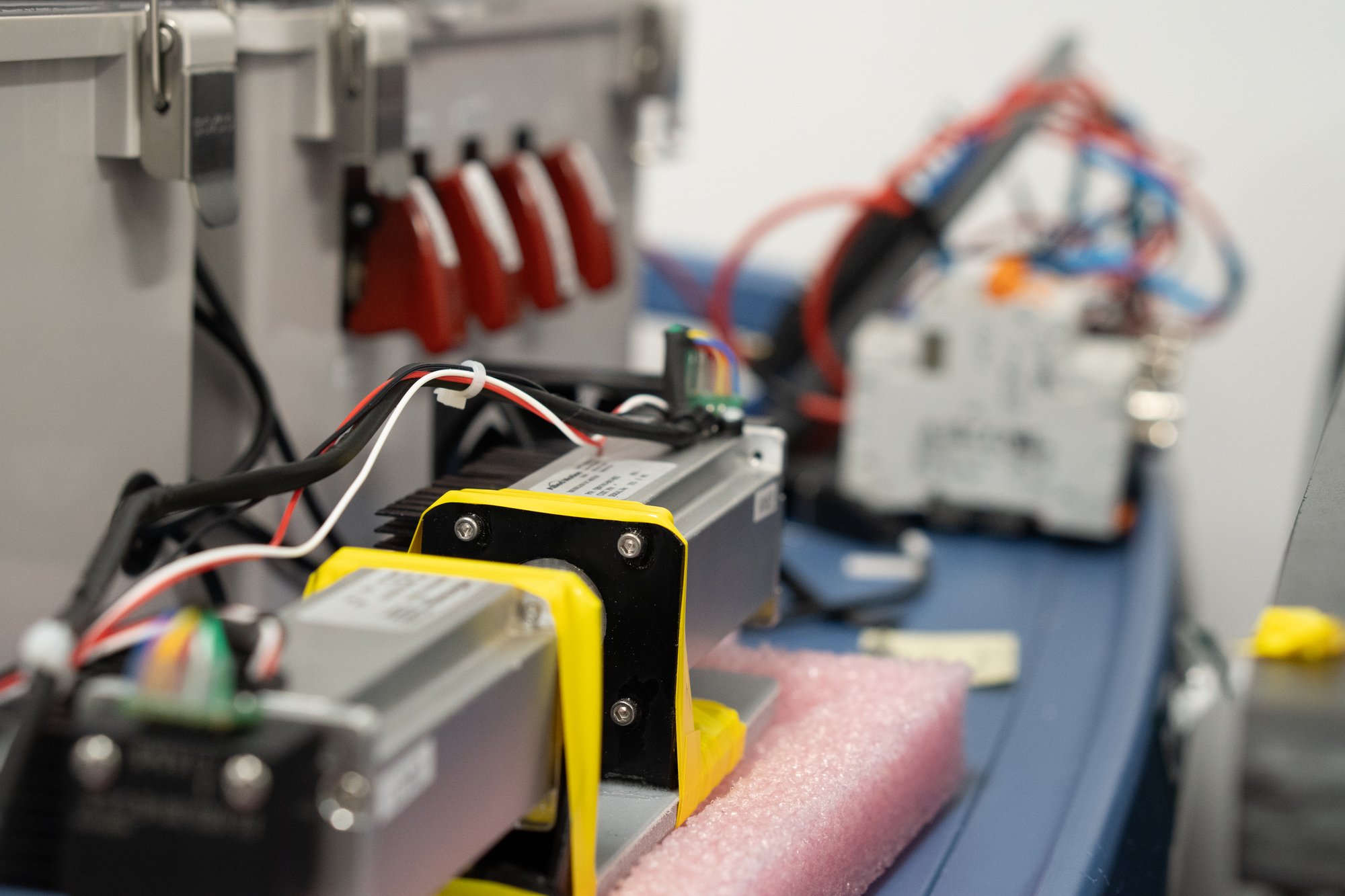 Regenerative Energy test stand with dual motors and wiring in background